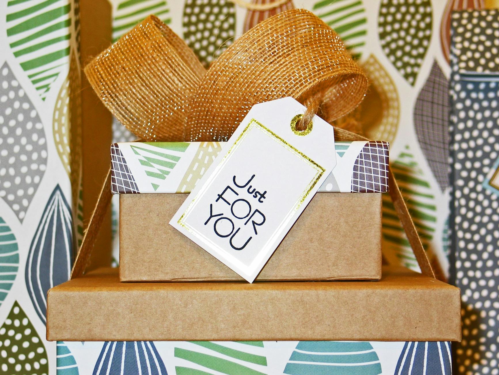 close up photo of gift boxes with greeting card