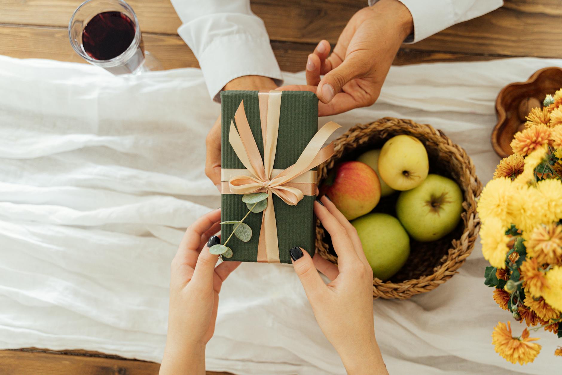 person giving a gift box