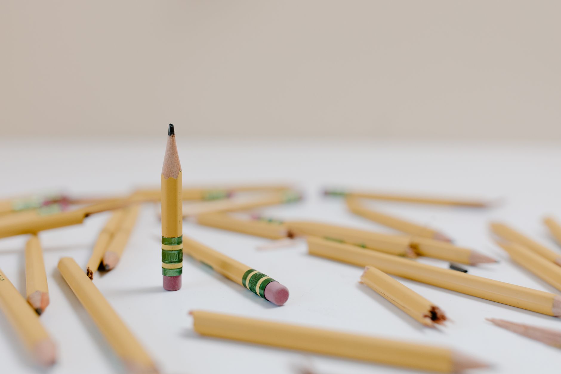 yellow wooden pencils on white surface